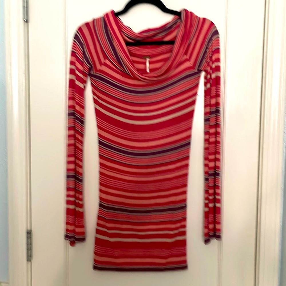 Striped, rolled scoop neckline tunic with flare sleeves.
